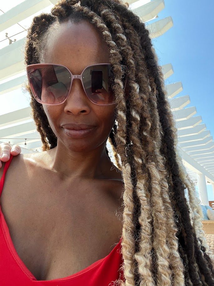 Long braided style at a resort pool cabana